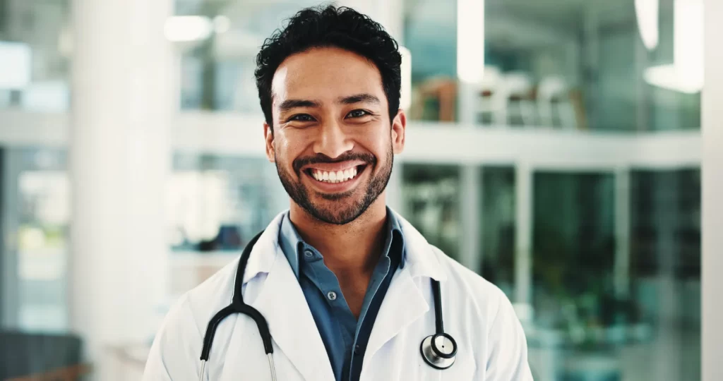 happy doctor and portrait of man in hospital lobb utc